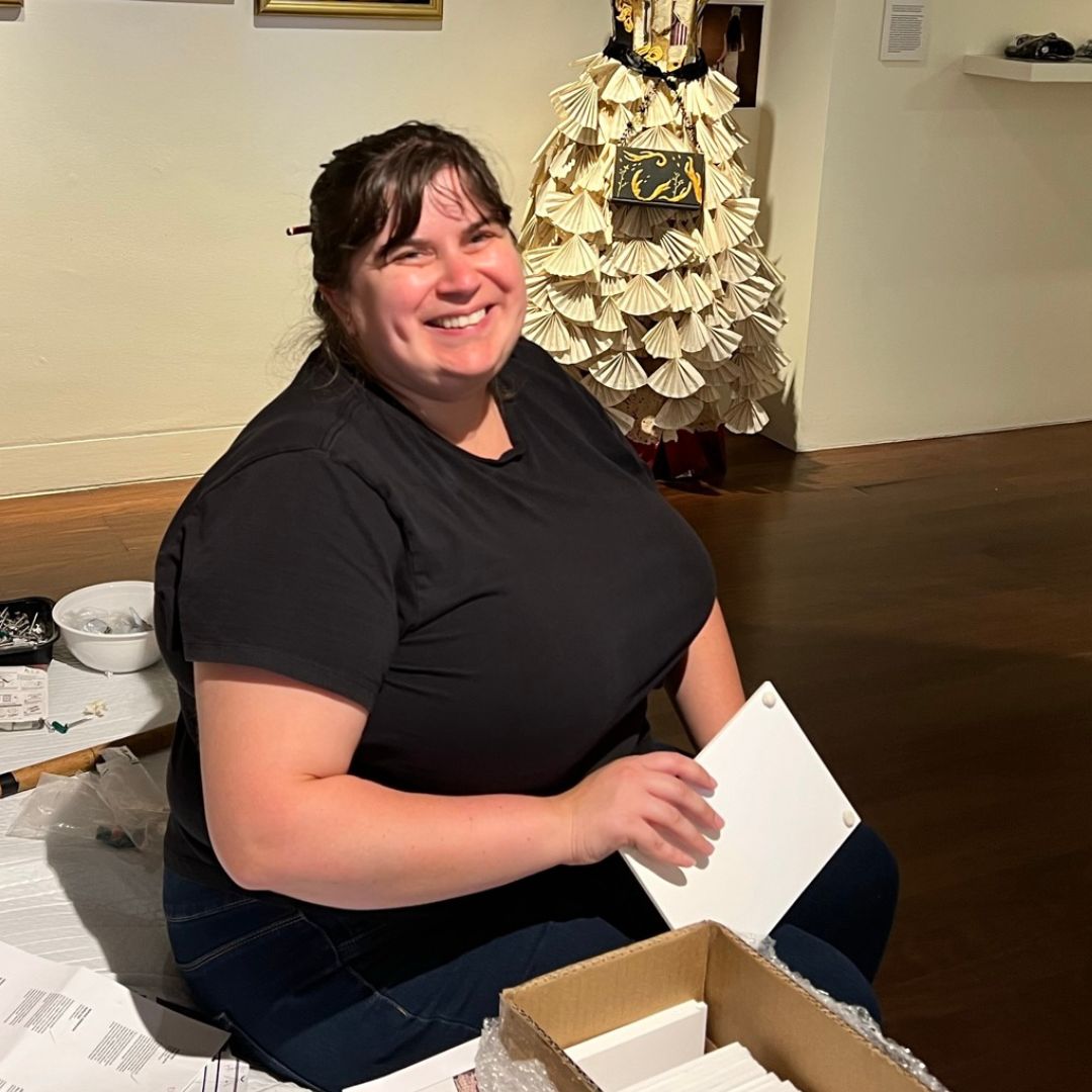 photo of jodie dowd sitting in the art gallery