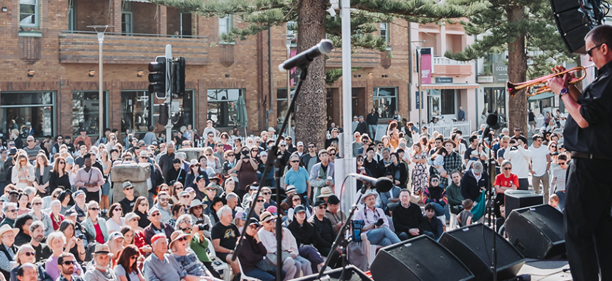 Man playing trumpet at Manly Jazz in front of a large crowd
