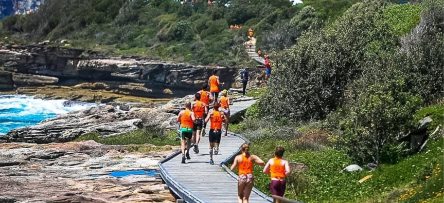 Runners along the board walk