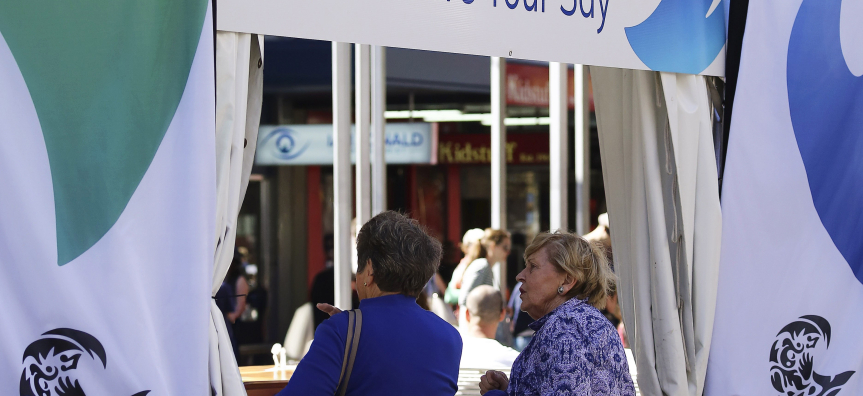 People at a community engagement event stall