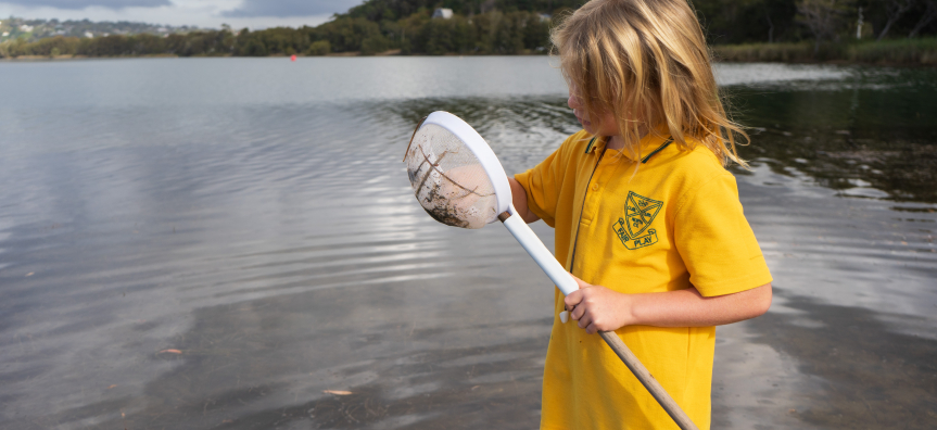 child with a dip net