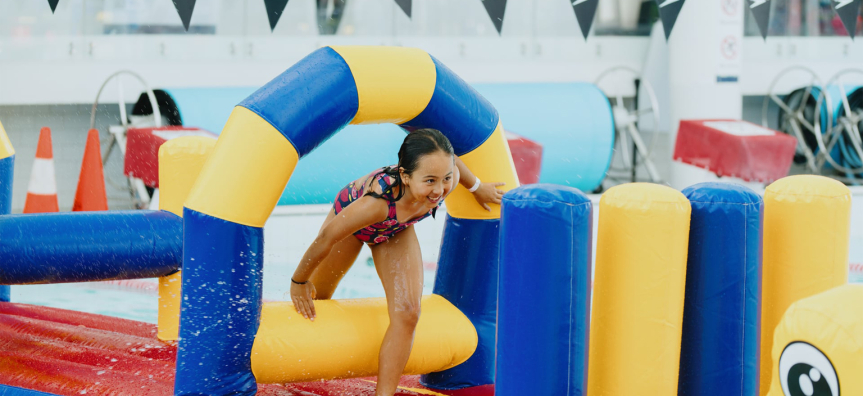 Child on an inflatable at the pool