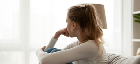 Person at home peering out