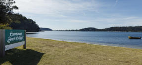 Currawong Beach Cottages sign