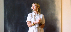 Artist Susie Dureau in front of painting