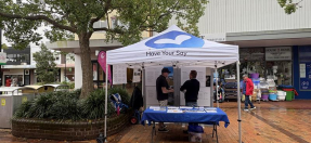 People at a community engagement event stall